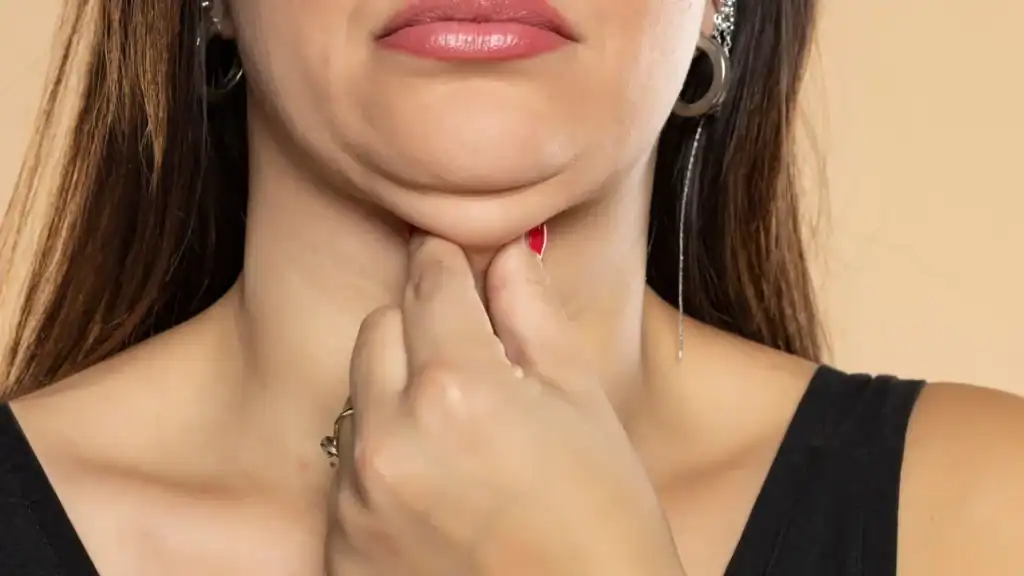 An image of a woman with double chin, sad, worried : Non Surgical Double Chin Removal Treatment in Rayleigh, UK